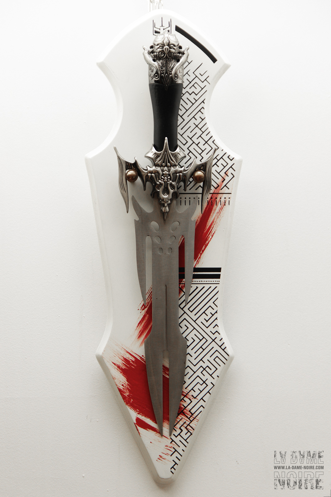 Global wiew of a fantasy viking sword painted in white and red