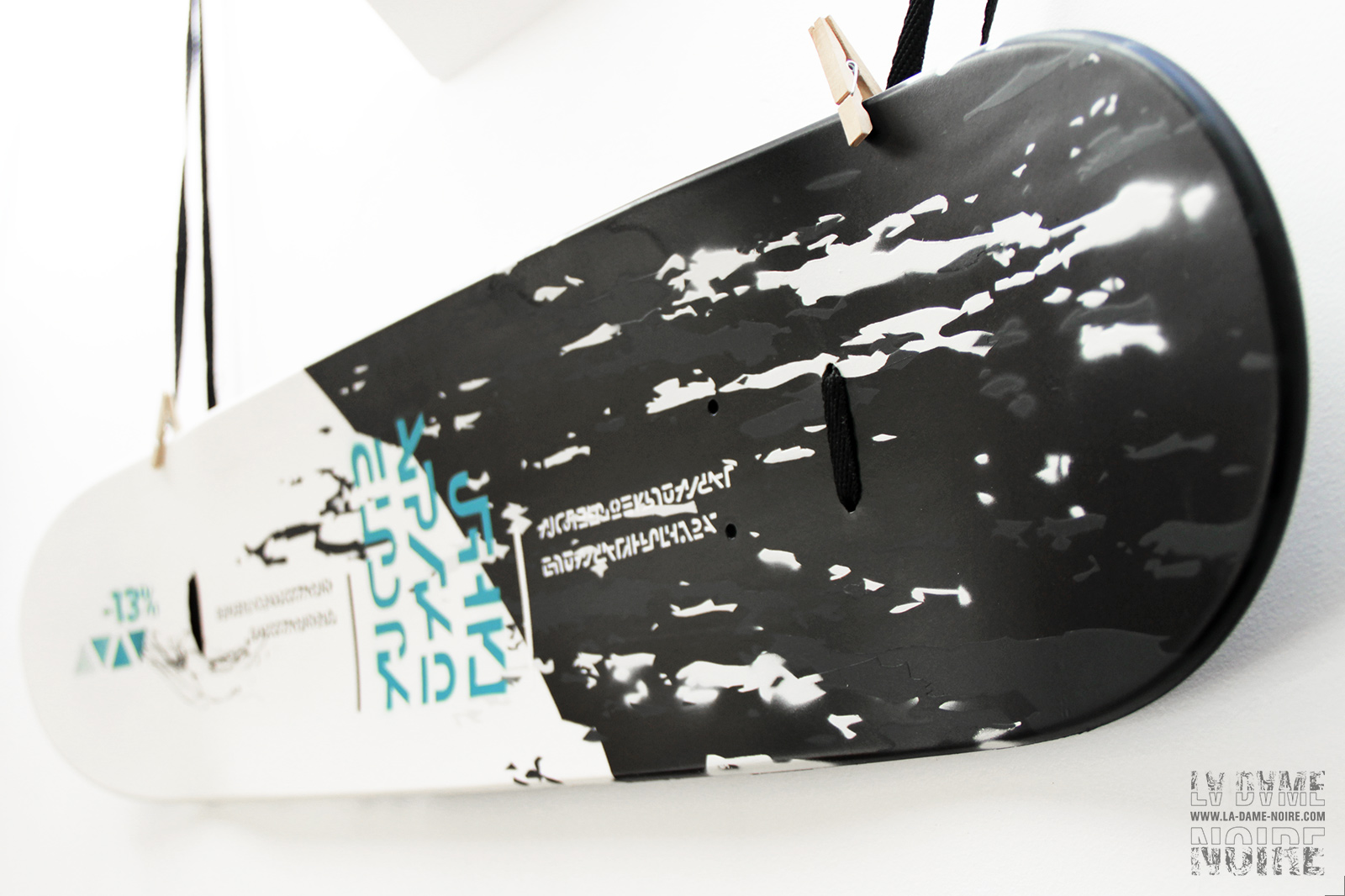 Details of the skateboard with black background and white shapes